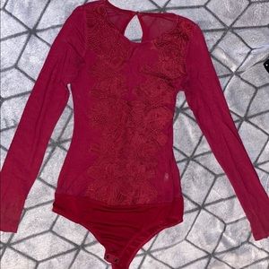 Fashion Nova Long sleeve burgundy floral bodysuit.